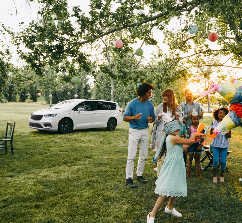 Family party in front of Chrysler